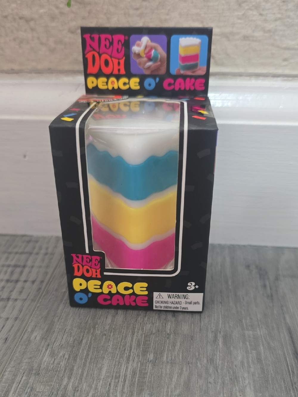 Peace O' Cake  Nee doh Rainbow Squeeze Toy - Blue, Yellow, Pink, White